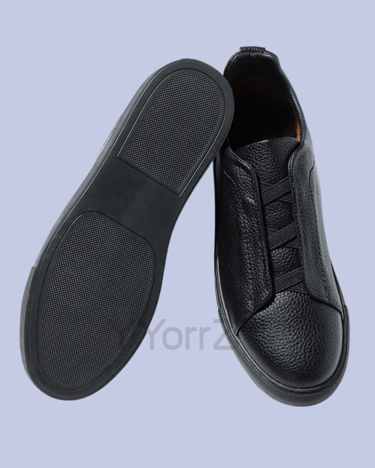 The sole and top view of the Black Triple Stitch Slip-On Low-Top Sneakers