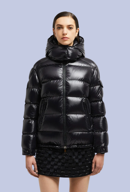 A female model wearing the Glossy Down Puffer Hooded Jacket