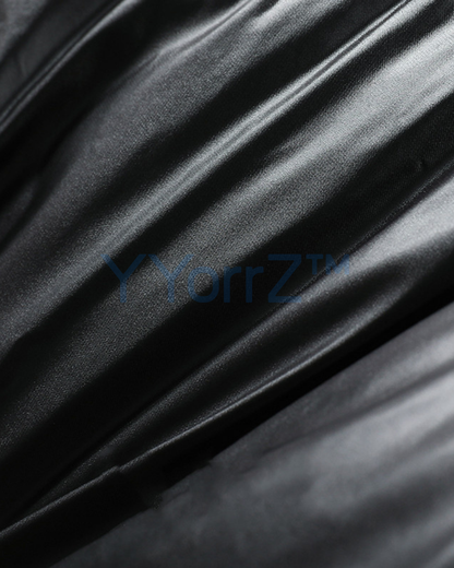 The leather of the black faux jacket.